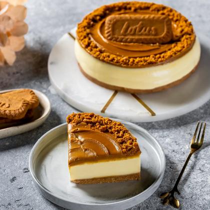 Whole Biscoff cheesecake and a slice served together