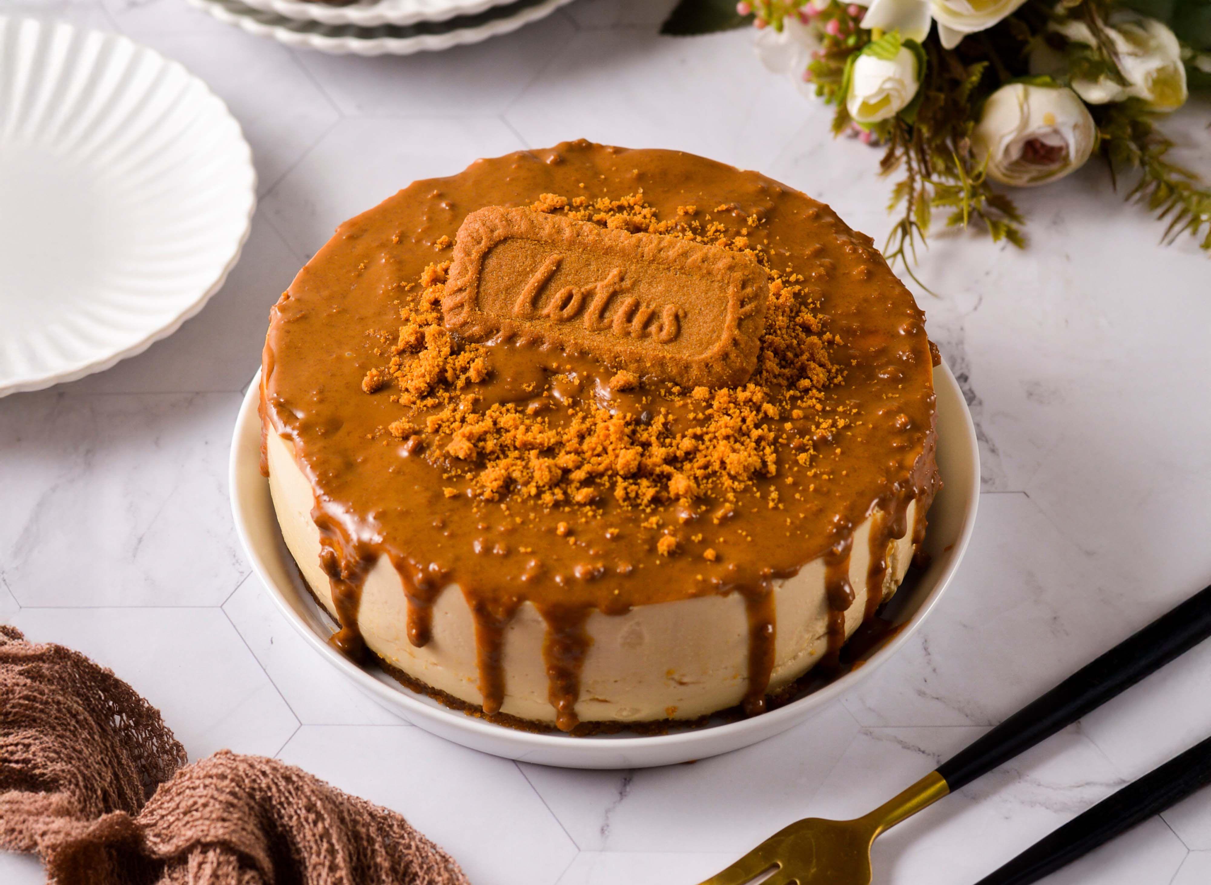 Whole Lotus Biscoff cheesecake topped with caramel spread and biscuit crumbs